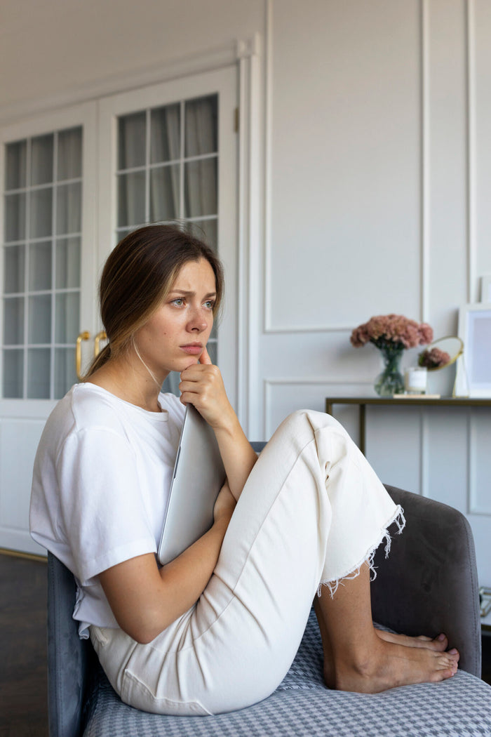 Woman sitting stressed